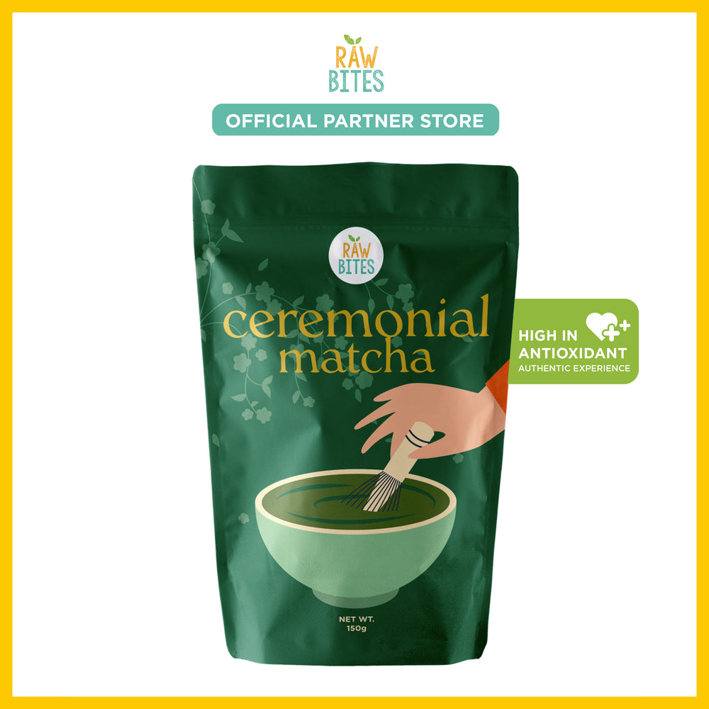 Green package of Raw Bites ceremonial matcha with a hand stirring matcha in a bowl.