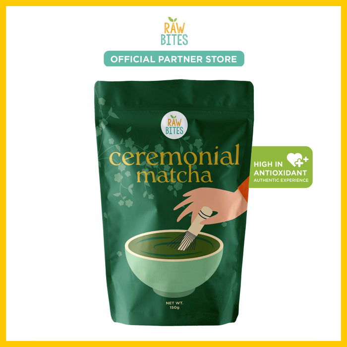 Green package of Raw Bites ceremonial matcha with a hand stirring matcha in a bowl.